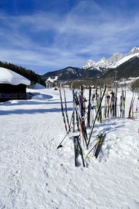 Scenic view of snow covered field against sky