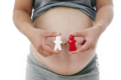 Midsection of woman holding ice cream cone