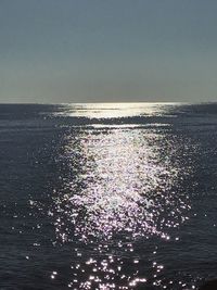 Scenic view of sea against clear sky during sunset