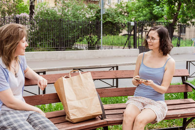 Happy woman sitting on bench