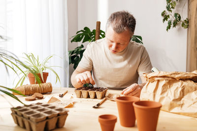 Young woman using mobile phone at home