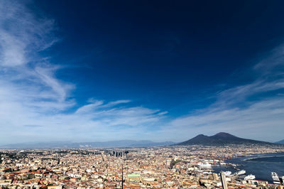 High angle view of townscape against blue sky