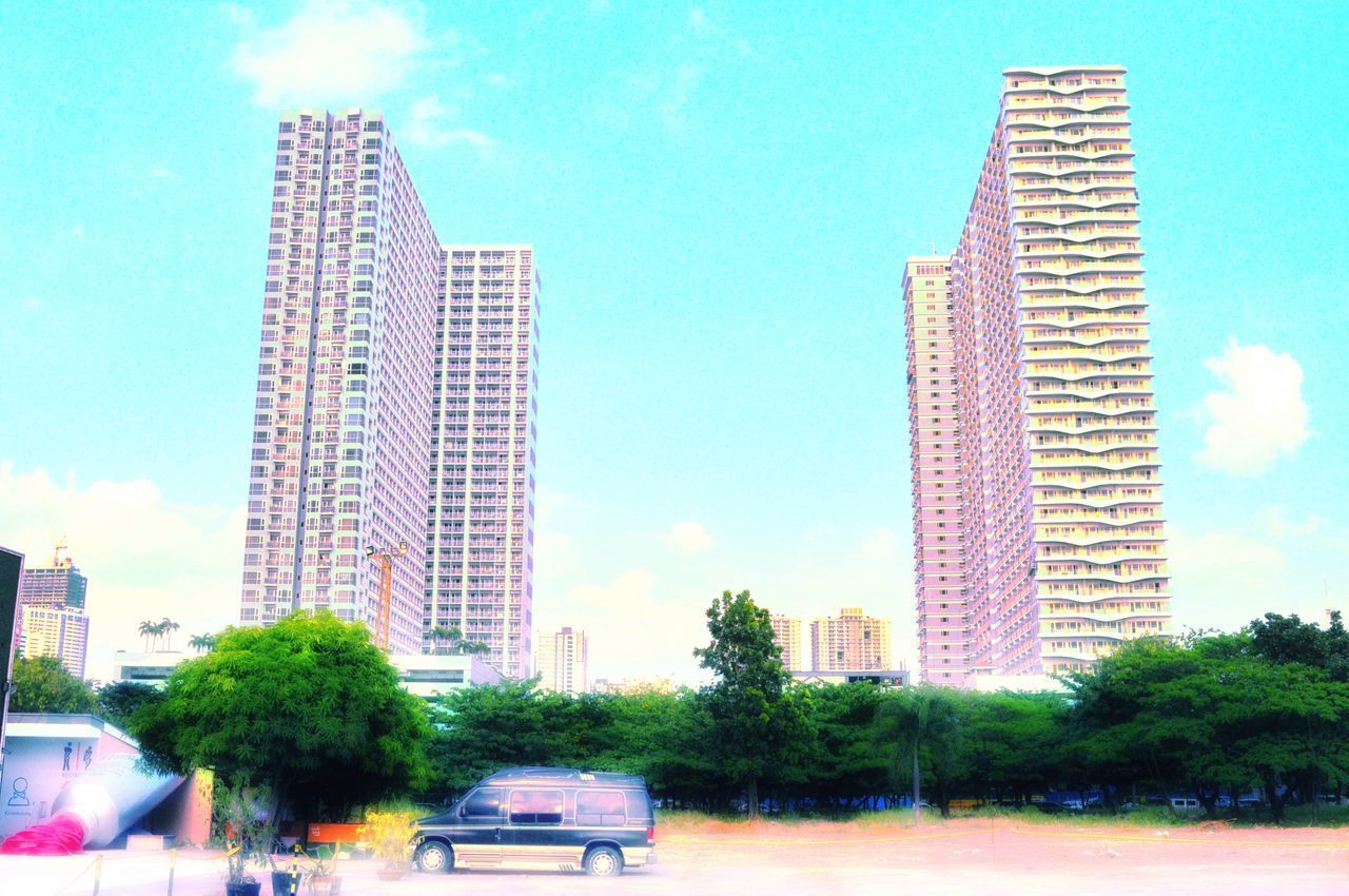 VIEW OF MODERN BUILDINGS AGAINST SKY