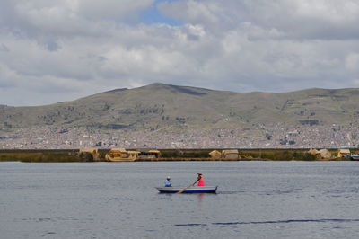 Friends on boat sailing in river