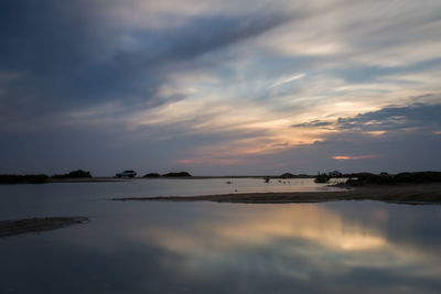 Scenic view of sea against sky at sunset