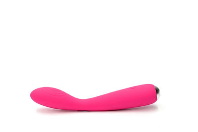 Close-up of pink over white background