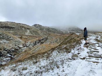 Man standing on snow