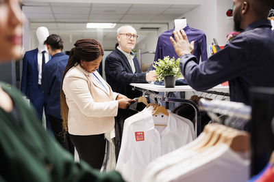 Midsection of business colleagues stacking hands