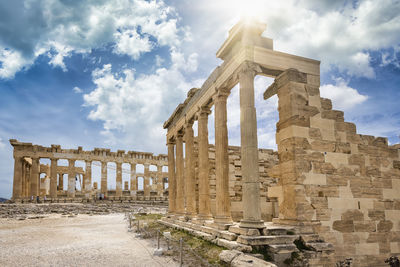 Old ruins of temple against cloudy sky