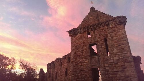 Low angle view of old building against sky