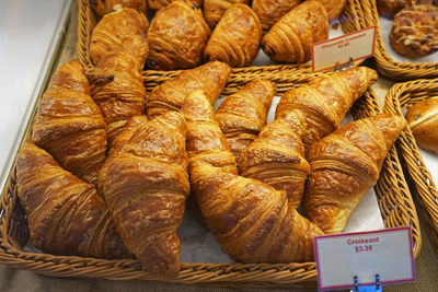 Close up display shelf of plain butter croissants