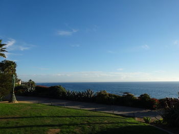 Scenic view of sea against blue sky