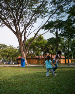 Full length of children playing in park