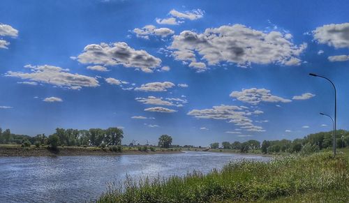 Scenic view of lake against blue sky