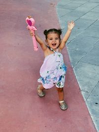 Portrait of cute girl walking on street