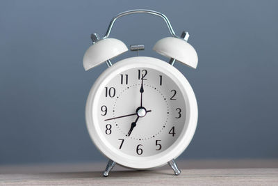 Close-up of clock on table