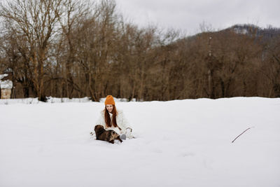 Dog on snow covered landscape