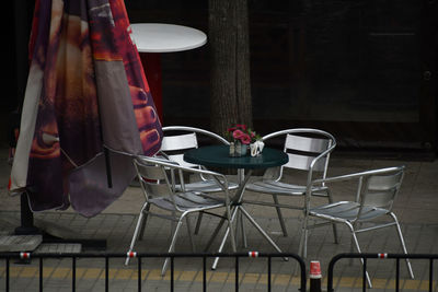 Empty chairs and tables in cafe