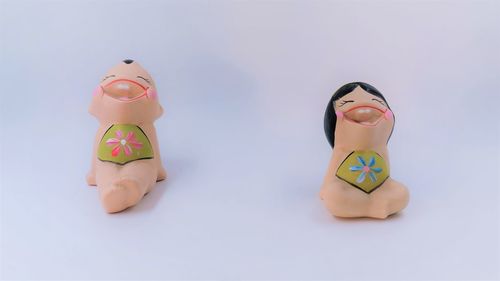 Close-up of figurine against white background