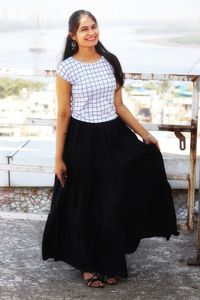 Portrait of a smiling young woman standing outdoors