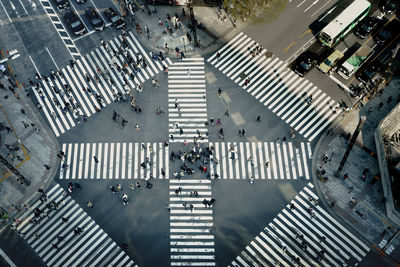 High angle view of people walking on city street