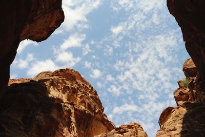 Low angle view of rock formations against sky