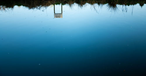 Scenic view of lake against blue sky