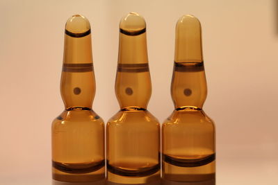 Close-up of bottles against white background