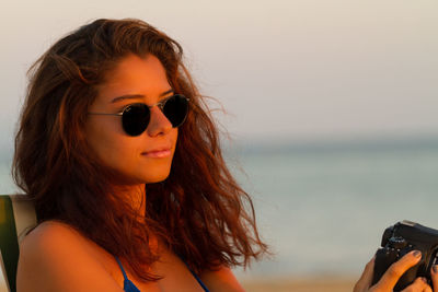 Close-up of young woman on beach