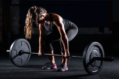 Athlete weightlifting in gym