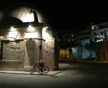 View of illuminated street lights at night