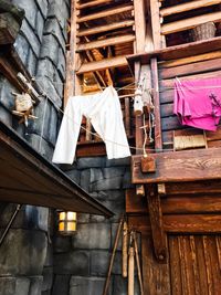 Low angle view of clothes drying on roof of building