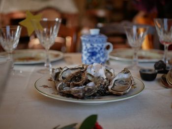 Close-up of oysters in plate on table