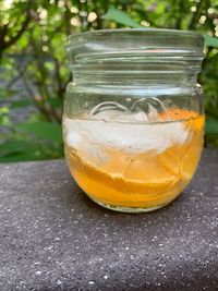 Close-up of drink in glass jar on table