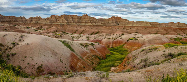 Rock formations on landscape against sky