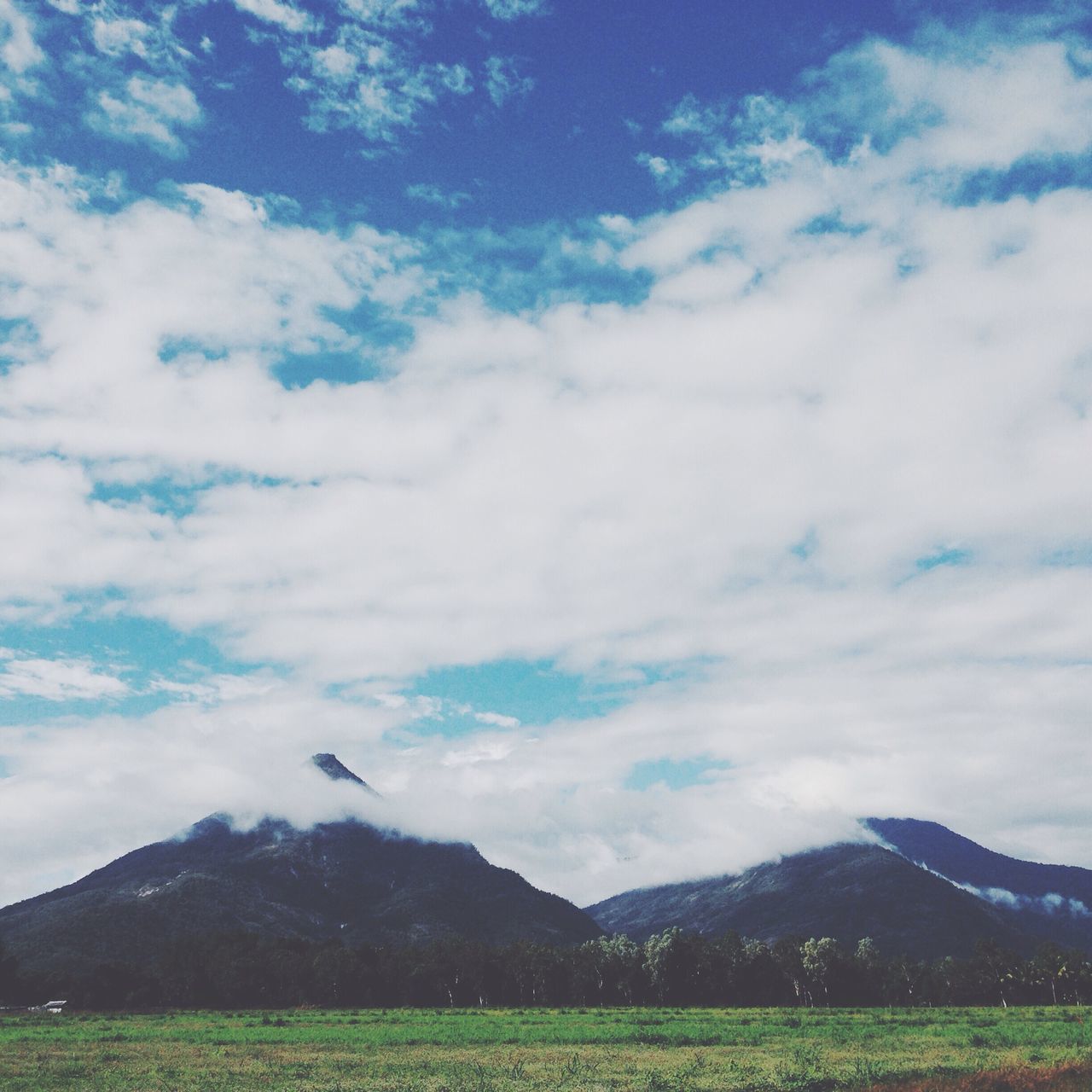 mountain, landscape, sky, tranquil scene, scenics, tranquility, mountain range, beauty in nature, nature, cloud - sky, cloud, non-urban scene, grass, hill, field, day, idyllic, remote, cloudy, outdoors