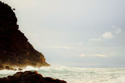 Scenic view of sea and cliff