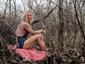 Portrait of woman sitting outdoors