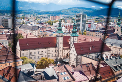 Landhaus and cityscape seen through window