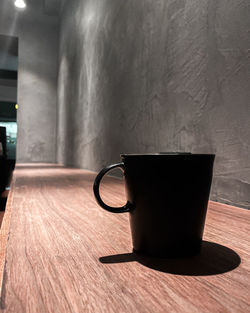 Close-up of coffee cup on table