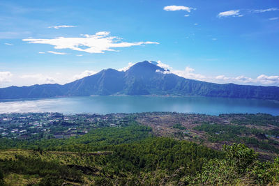 Scenic view of mountains against blue sky