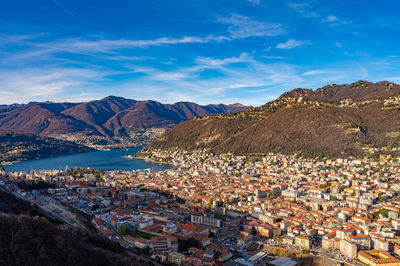 The city of como, the lake, the lakeside promenade, the buildings, photographed from above.