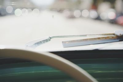 Close-up of car windscreen against blurred background