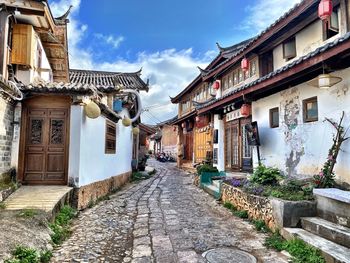 Footpath amidst buildings in town