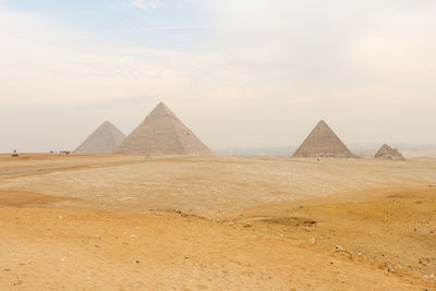 The great pyramids of egypt in a desert landscape