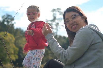 Portrait of mother and daughter outdoors