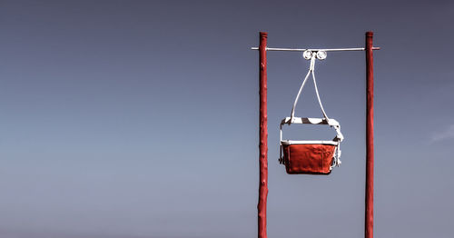 Swing against clear sky