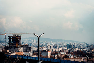 High angle view of street and buildings against sky