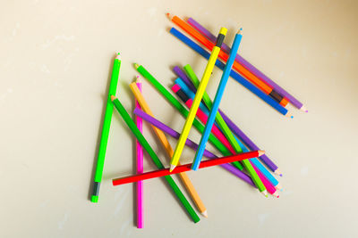High angle view of colorful pencils on white background