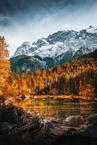 Scenic view of snowcapped mountains against sky during autumn
